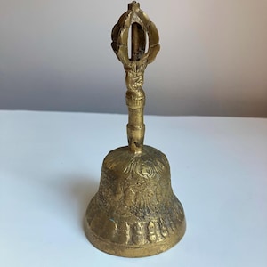 Antique solid brass bell with crown top and people designs in relief - lots of detail