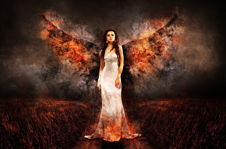 May include: Digital artwork depicting a woman in a white dress with fiery wings. The wings are a blend of orange, red, and black, set against a dark, textured backdrop. The woman has long, dark hair and stands in a field.