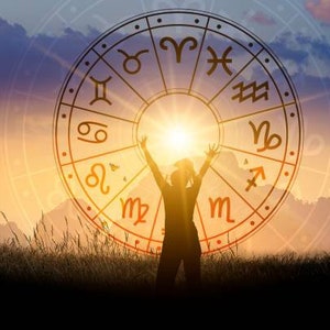 May include: Silhouette of a person with arms raised towards a bright sun, set against a backdrop of a zodiac wheel with astrological symbols. The image is set during a sunset with a warm color palette.