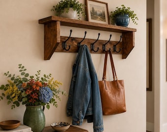 Handmade wooden wall mounted coat rack with storage shelf, featuring sturdy cast iron hooks