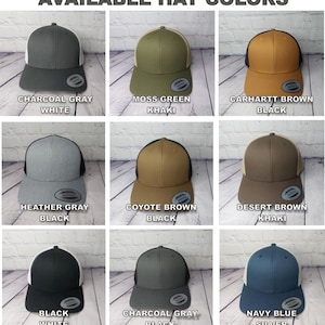 May include: Nine different color trucker hats with a mesh back. The hats are available in charcoal gray, moss green, carhartt brown, heather gray, coyote brown, desert brown, black, charcoal gray, and navy blue.