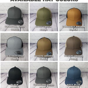 May include: An image showcasing a variety of trucker hats in different colors. The hats include Charcoal Gray with White, Moss Green with Khaki, Carhartt Brown with Black, Heather Gray with Black, Coyote Brown with Black, Desert Brown with Khaki, Black with White, Charcoal Gray with Black, and Navy Blue with Silver.