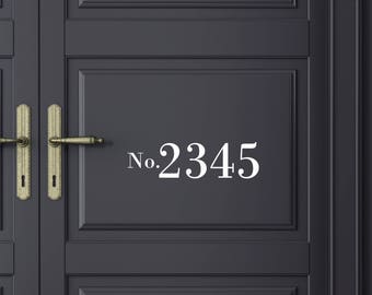 May include: A black door with a gold door handle and a white number plaque that reads "No. 2345".