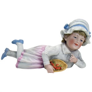 Bisque Girl Lying on Stomach with Basket of Fruit