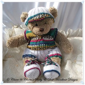 May include: A brown teddy bear wearing a white knitted hat with a colourful stripe, a colourful striped vest, white knitted trousers with colourful stripes, and white knitted booties with colourful stripes.
