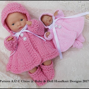 May include: Two pink knitted doll outfits with white ribbon accents. The larger outfit has a hood and booties. The smaller outfit has a dress and matching booties. Pattern A32 © Claire @ Baby & Doll Handknit Designs 2017.