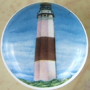 May include: A white and brown lighthouse with a white roof and a black stripe around the middle, against a blue sky with white clouds.