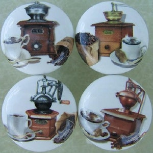 May include: Four ceramic knobs with images of coffee grinders and cups of coffee. Each knob features a different style of grinder and a cup of coffee with a saucer. The knobs are white with a glossy finish.