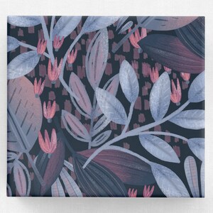 May include: A seamless pattern featuring a dark blue background with a repeating design of pink flowers and blue leaves. The leaves are stylised and have a watercolour effect.