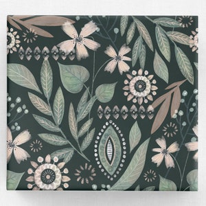 May include: A square canvas print featuring a botanical pattern. The design includes stylized flowers, leaves, and geometric shapes in shades of green, beige, and white against a dark green background. The print has a matte finish.