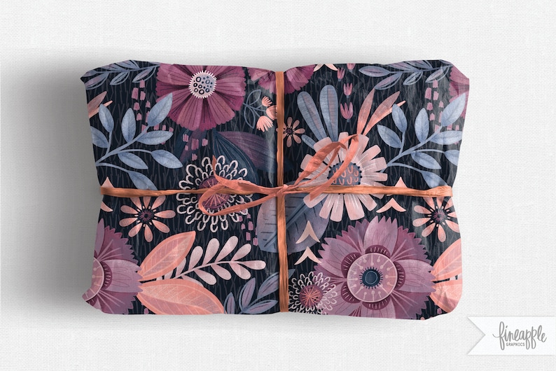 May include: A gift wrapped in floral patterned paper with a pink ribbon. The paper features a dark blue background with pink, peach, and white flowers and leaves.