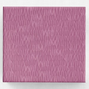 May include: Pink wrapping paper with a white abstract pattern of lines and dashes.