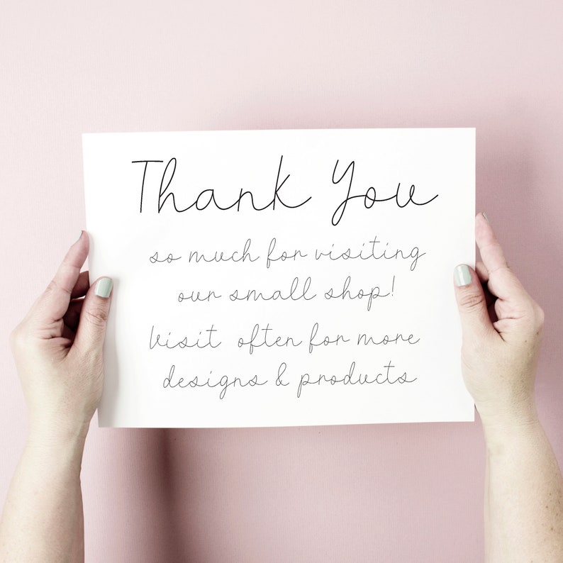 May include: A white card with black handwritten text that says "Thank You so much for visiting our small shop! Visit often for more designs & products".