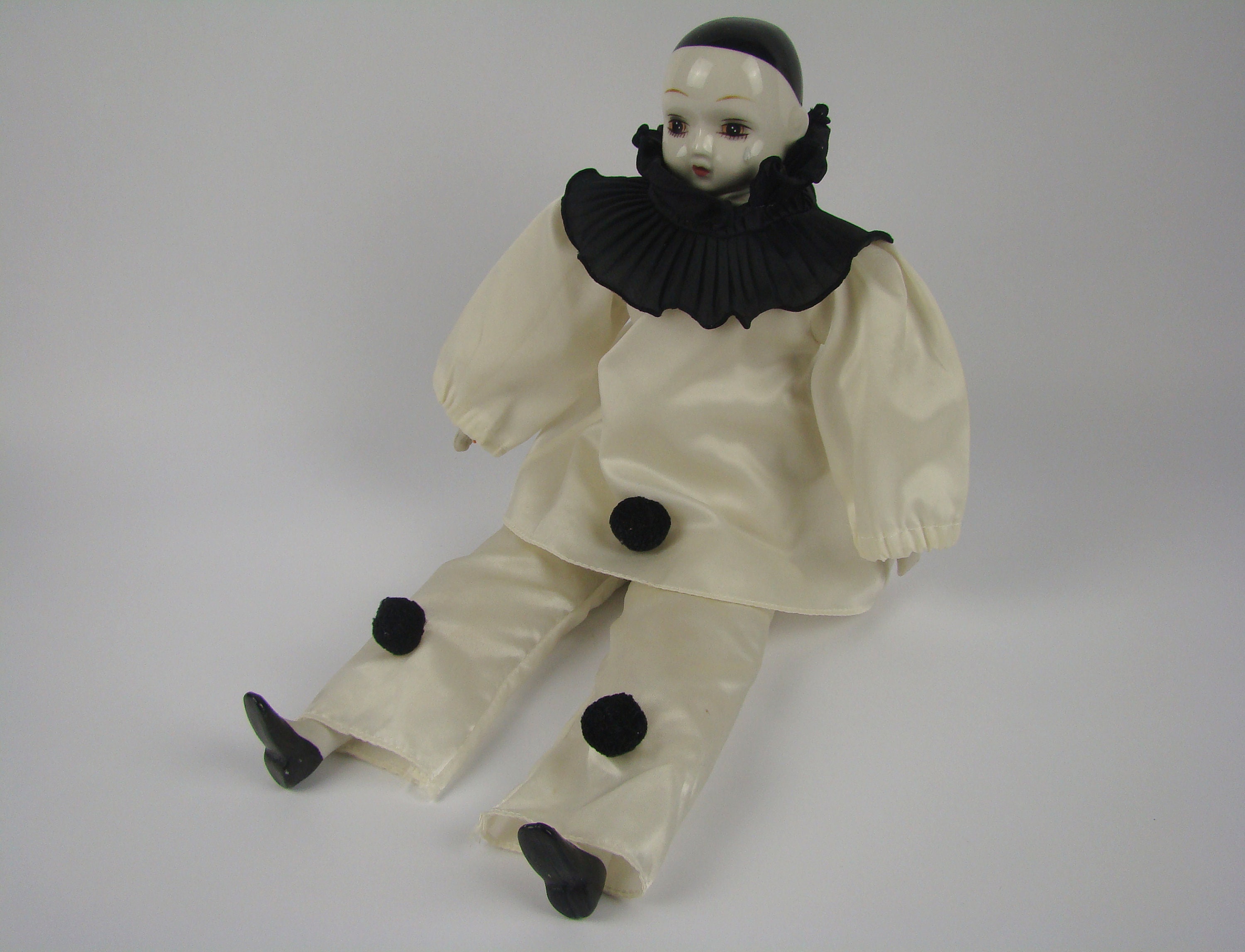 Black and white porcelain clown doll hotsell