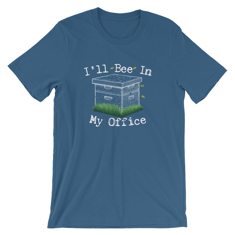 May include: A blue t-shirt with the text "I'll Bee In My Office" and a cartoon image of a beehive with bees flying around it.