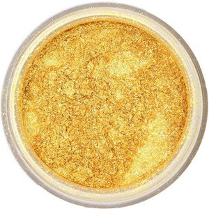 May include: A close-up of a jar filled with gold glitter. The glitter is fine and shimmery, and it is perfect for adding a touch of sparkle to any project.