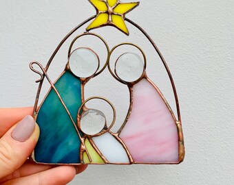 Stained glass nativity Christmas decor Holiday traditions Candlelit magic Faithful decor Unique home accessories Christmas centerpiece