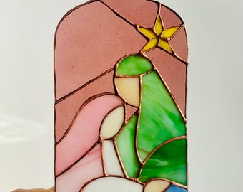 Stained glass nativity Christmas decor Holiday traditions Candlelit magic Faithful decor Unique home accessories Christmas centerpiece