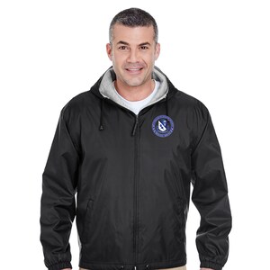May include: Black hooded jacket with a zipper closure and a logo on the left chest. The logo is a blue circle with a white lightning bolt and the text "United States Air Force" around the circle.