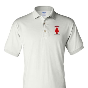 May include: A white polo shirt with short sleeves and a collared neckline. The shirt features a small emblem on the left chest with the text "AIRBORNE" above a red arrow and the text "UNITED STATES ARMY SPECIAL OPERATIONS CMD" below.