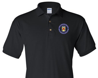 May include: Black polo shirt with a blue and gold embroidered patch that reads "1st Infantry Division" and "Duty First".