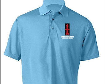 May include: Light blue polo shirt with a collar and three buttons. The shirt features a black and red graphic with the text "32ND INFANTRY BRIGADE" and "RED ARROW BRIGADE".