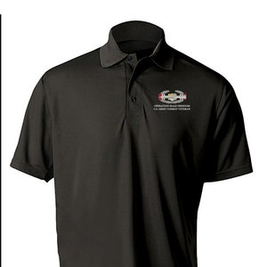 May include: Black polo shirt with an embroidered patch that reads "Operation Iraqi Freedom U.S. Army Combat Veteran".