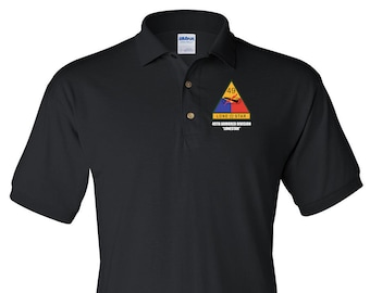 May include: Black polo shirt with a patch featuring a yellow triangle with a red and blue star inside. The patch has the text "49th Armored Division" and "Lone Star" on it.
