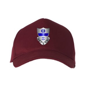 May include: A maroon baseball cap with a silver and blue patch featuring a shield with a building, a blue stripe, and a cross. The text "LET'S GO" is written around the shield.