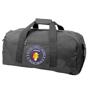 May include: Black duffel bag with a circular patch that reads "Southern European Task Force Airborne Proudly Served" with a crest in the center.