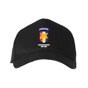 May include: Black baseball cap with a blue and yellow patch that says "Airborne" and "Southern European Task Force".