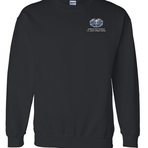 May include: Black sweatshirt with a Korean War Veteran U.S. Army Combat Medic patch on the left chest.