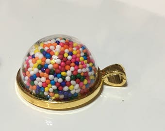 Beautiful glass globe necklace cake sprinkles