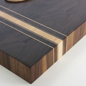 Large walnut cutting board with white lines