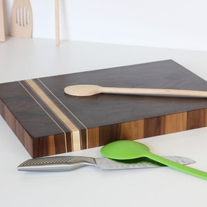 dark walnut cutting board with lines