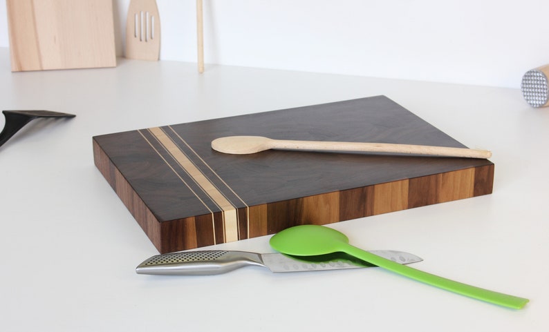 dark walnut cutting board with lines