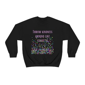 May include: Black sweatshirt with the text "Throw kindness around like confetti" in purple. The text is surrounded by a scattering of colorful confetti.