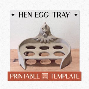 May include: A grey hen-shaped egg tray with six circular openings. The tray has a hen's head design at the top and the words "HEN EGG TRAY" are printed above it. The words "PRINTABLE TEMPLATE" are printed at the bottom.