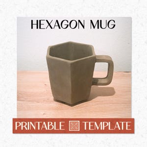 May include: A brown hexagon-shaped mug with a square handle. The mug is made of a matte material and sits on a wooden surface. The text "HEXAGON MUG" is above the mug, and "PRINTABLE TEMPLATE" is below.