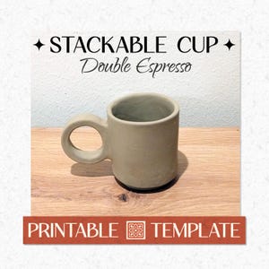 May include: A stackable, light-colored ceramic mug with a rounded handle. The mug is labeled "STACKABLE CUP Double Espresso" in black text. A rectangular banner at the bottom reads "PRINTABLE TEMPLATE". The mug sits on a wooden surface.