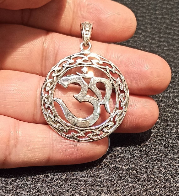 Silver on sale om pendant