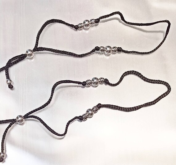 Black thread silver anklets deals