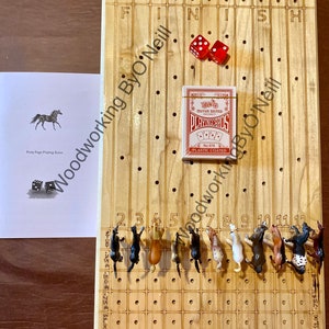 Courses hippiques. Jeu de dés. Chevilles à poney.