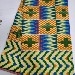 May include: A yellow, green, blue, and orange patterned fabric with the text "SKE 2010" and "SUPER" printed on the bottom edge.