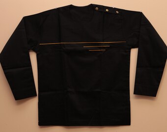 May include: A black long-sleeved shirt with a gold trim design. The shirt has a round neckline and a button closure at the neck.