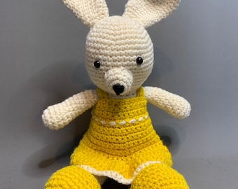 Crochet bunny dressed in yellow