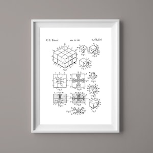 May include: A black and white line drawing of a patent for a cube puzzle. The patent is titled "U.S. Patent" and the date is "Mar. 25, 1983". The patent number is "4,378,116". The drawing shows the cube in different positions and configurations.