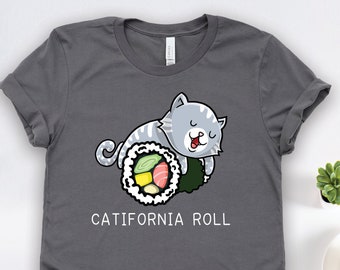 Op de afbeelding: Een antracietgrijs T-shirt met een cartoonkat die op een sushirol ligt. De tekst "CATIFORNIA ROLL" staat onder de kat.