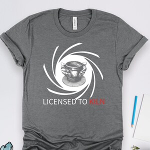May include: Gray t-shirt with a white graphic of a pottery wheel and the text "Licensed to Kiln" in red.