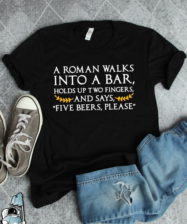 May include: Black t-shirt with white text that reads "A Roman walks into a bar, holds up two fingers, and says, "Five beers, please."